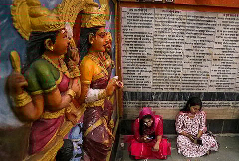 People visit the 'Alopi Shankari Devi Shakti Peeth Mandir' on the second day of the 'Navaratri' festival, in Prayagraj.