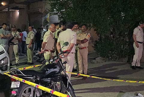 Police personnel at the site of a firing incident where a boy was allegedly shot dead and his father injured by armed attackers, at Bawana in New Delhi.