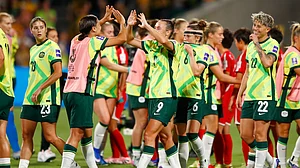 (AP Photo/Gary Day) : Australia's Sam Kerr and teammate Australia's Caitlin Foord celebrate following the Women's Asian Cup quarterfinal soccer match between Australia and North Korea in Perth, Australia, Friday, March 13, 2026.