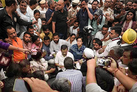 Aam Aadmi Party national convenor Arvind Kejriwal with party workers at Palam, in New Delhi. He alleged that BJP workers blocked his visit to the family of a Palam fire victim. 