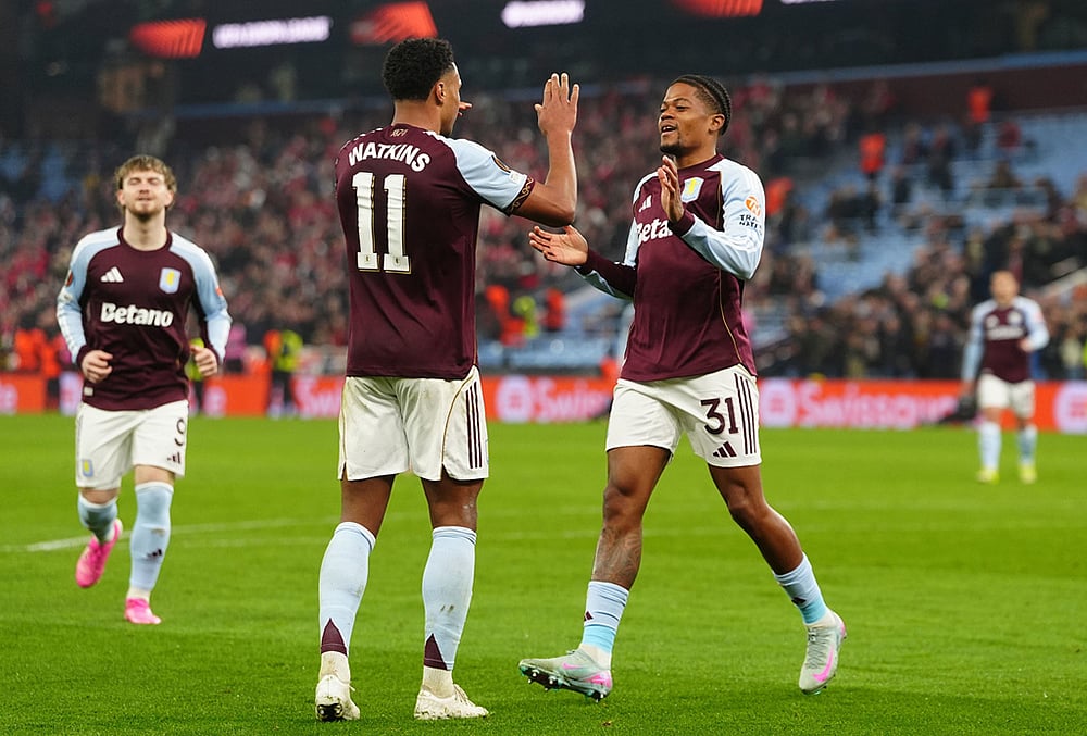 Aston Villa's Leon Bailey, right, celebrates with his teammate Ollie Watkins after scoring his side's second goal during the Europa League round of sixteen second leg soccer match between Aston Villa and LOSC Lille in Birmingham, England. - | Photo: David Davies/PA via AP