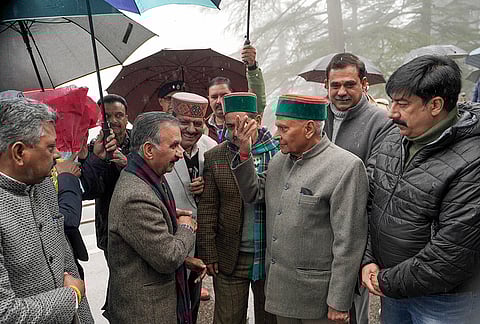 Himachal Pradesh Chief Minister Sukhvinder Singh Sukhu, second left, arrives for the Budget session of the state Assembly, in Shimla.