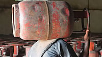 The LPG Crisis: Queues, Chaos, And An Empty Cylinder | Photo: Tribhuvan Tiwari : In Short Supply: A man carrying an LPG cylinder at an HP agency in Uttar Pradesh amid the ongoing crisis