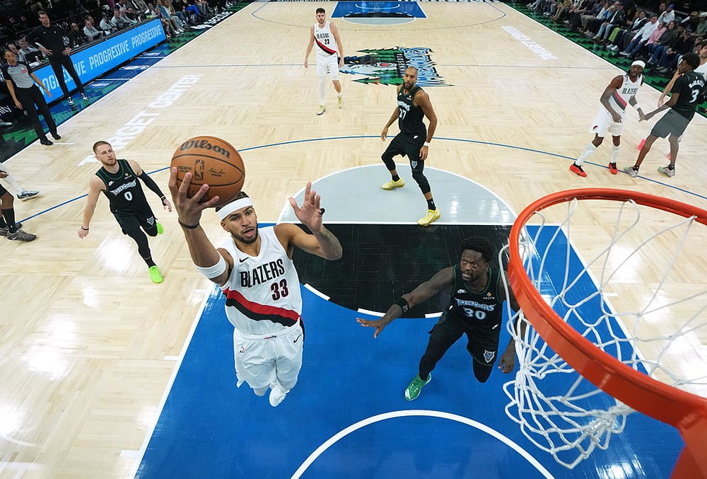 Portland Trail Blazers forward Toumani Camara (33) shoots during the first half of an NBA basketball game against the Minnesota Timberwolves in Minneapolis.  - | Photo: AP/Abbie Parr