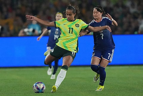 Australia's Mary Fowler, left, against Japan's Hinata Miyazawa during the Women's Asian Cup soccer final between Japan and Australia in Sydney.