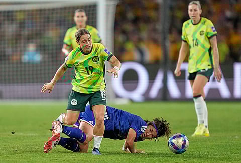 Japan's Hana Takahashi and Australia's Katrina Gorry battle for the ball during the Women's Asian Cup soccer final between Japan and Australia in Sydney.