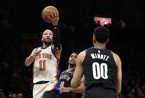 Brooklyn Nets forward Chaney Johnson (31) and New York Knicks forward Mohamed Diawara reach for the rebound off a missed free throw by New York Knicks center Karl-Anthony Towns during the second half of an NBA basketball game in New York.