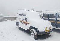 | Photo: PTI : Snow covers vehicles, at Sandakphu area in Darjeeling district, West Bengal.