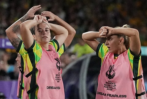 Australia players on the bench react after a missed goal during the Women's Asian Cup soccer final between Japan and Australia in Sydney.