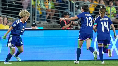 Japan's Maika Hamano, left, celebrates with teammates after scoring the opening goal during the Women's Asian Cup soccer final between Japan and Australia in Sydney, Saturday, March 21, 2026. 
