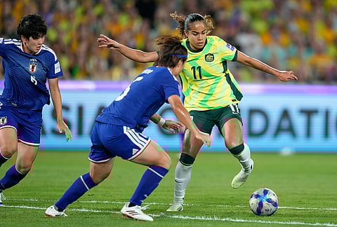 Japan's Hana Takahashi, challenges Australia's Mary Fowler during the Women's Asian Cup soccer final between Japan and Australia in Sydney.