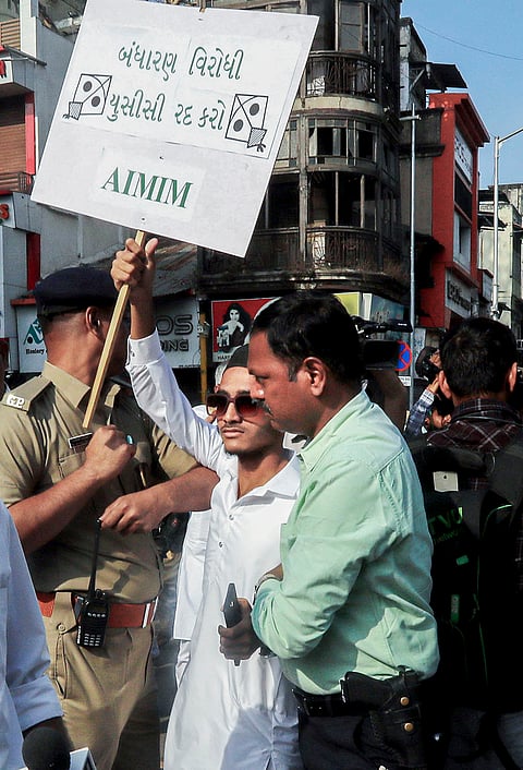 Police detain members of All India Majlis-e-Ittehadul Muslimeen (AIMIM) during a protest against the implementation of the Uniform Civil Code (UCC), in Ahmedabad.