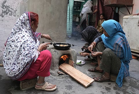 Amid LPG cylinder shortage, people resort to cooking using traditional methods such as the traditional wood fired 'chulha'