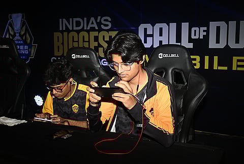 High-stakes mobile gaming Participants maintain deep focus during the Call of Duty Mobile open brackets
