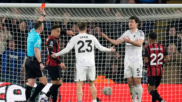 Manchester United's Harry Maguire (5) is sent off during a Premier League soccer match against AFC Bournemouth, Friday, March 20, 2026, in Bournemouth, England. - AP/Photo Andrew Matthews