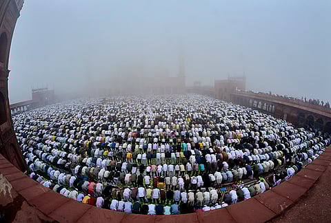 People from the Muslim community offer prayers on the occassion of Eid Al-Fitr, at Jama Masjid in New Delhi.