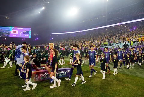 The Japanese team walk onto the pitch for the Women's Asian Cup soccer final between Japan and Australia in Sydney.
