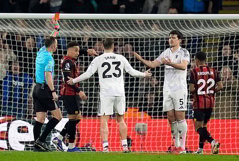 Manchester United's Harry Maguire (5) is sent off during a Premier League soccer match against AFC Bournemouth, in Bournemouth, England. 