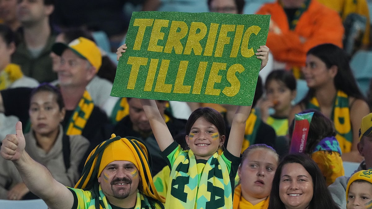 A fan of Australia holds a sign ahead of the Women's Asian Cup soccer final between Japan and Australia in Sydney, Saturday, March 21, 2026. - (AP Photo/Mark Baker)