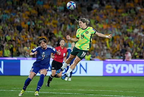 Australia's Katrina Gorry heads the ball as Japan's Hinata Miyazawa challenges during the Women's Asian Cup soccer final between Japan and Australia in Sydney.