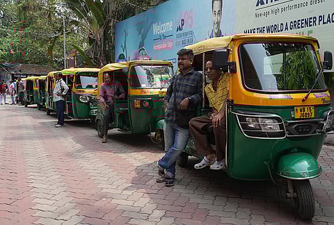 Auto rickshaw drivers waiting for refueling LPG at a pump in Hooghly District