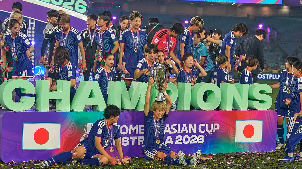 Japan's Maika Hamano celebrates with the trophy after winning the Women's Asian Cup soccer final between Japan and Australia in Sydney, Saturday, March 21, 2026.  - | Photo: AP/Rick Rycroft