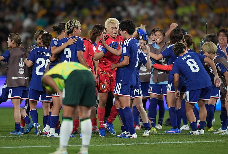 Japan players celebrate during the Women's Asian Cup soccer final between Japan and Australia in Sydney. - | Photo: AP/Mark Baker