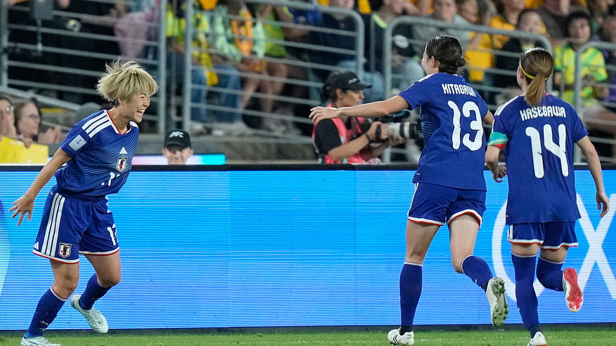 Japan's Maika Hamano, left, celebrates with teammates after scoring the opening goal during the Women's Asian Cup soccer final between Japan and Australia in Sydney, Saturday, March 21, 2026.  - (AP Photo/Rick Rycroft)