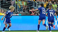 (AP Photo/Rick Rycroft) : Japan's Maika Hamano, left, celebrates with teammates after scoring the opening goal during the Women's Asian Cup soccer final between Japan and Australia in Sydney, Saturday, March 21, 2026. 