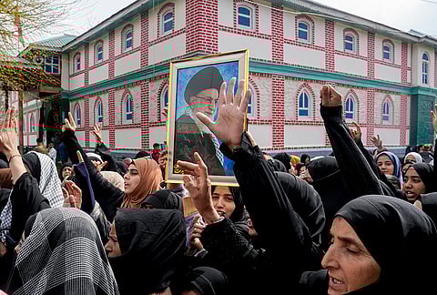 Muslims hold a portrait of Iran's Supreme Leader Ayatollah Ali Khamenei during a protest against US and Israel, after offering prayers on the occassion of 'Eid al-Fitr' festival, in Srinagar, Jammu and Kashmir.