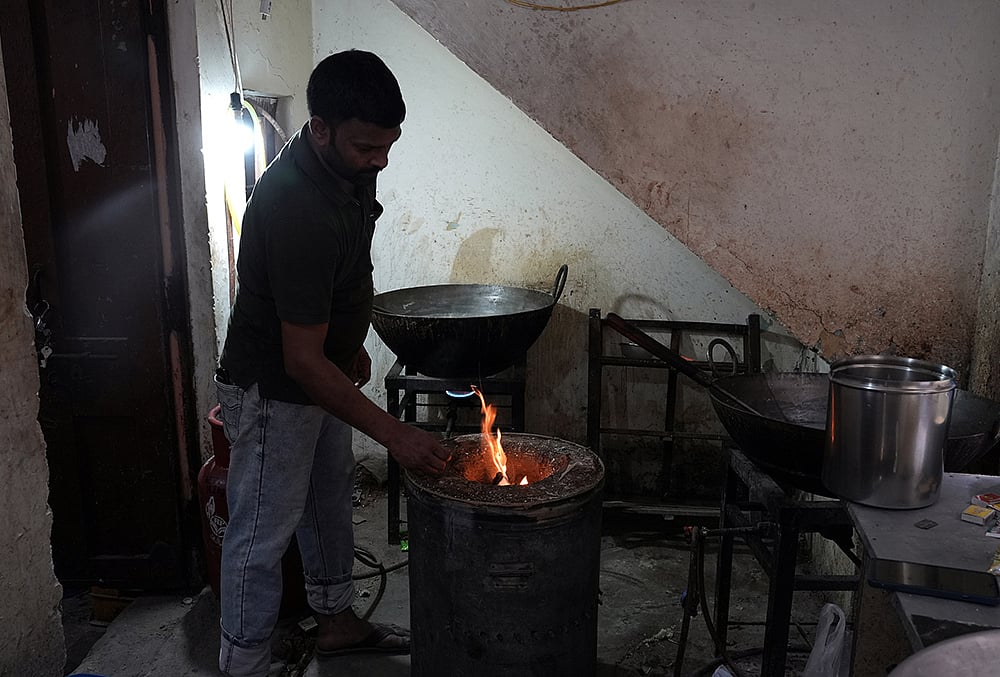 Amid LPG cylinder shortage, people resort to cooking using traditional methods