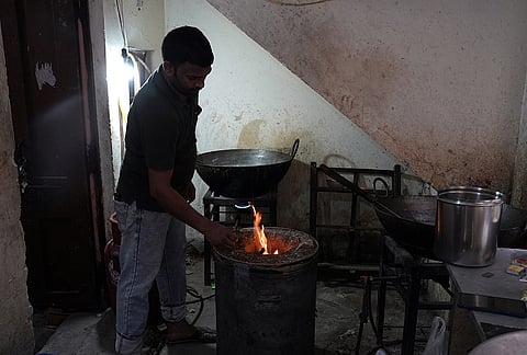 Amid LPG cylinder shortage, people resort to cooking using traditional methods
