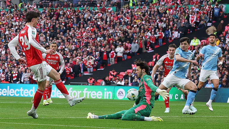 Manchester City's goalkeeper James Trafford makes a save from Arsenal's Kai Havertz during the English League Cup final soccer match between Arsenal and Manchester City in London, Sunday, March 22, 2026. - AP Photo