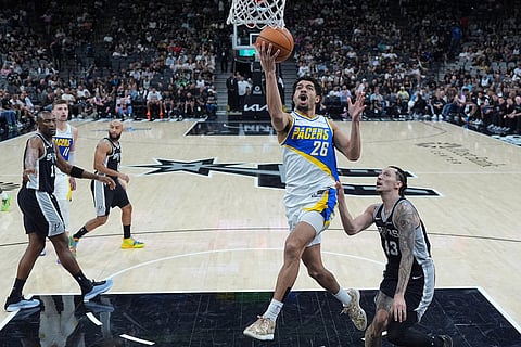 Indiana Pacers guard Ben Sheppard (26) drives to the basket past San Antonio Spurs forward Lindy Waters III (43) during the second half of an NBA basketball game in San Antonio.