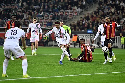 PSG's Desire Doue scores his side's second goal during the French League One soccer match between Nice and Paris Saint-Germain in Nice, France.