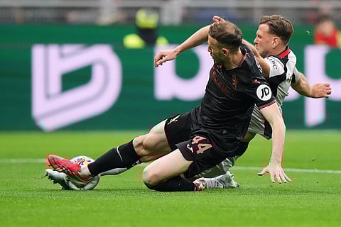 Torino's Ardian Ismajli, front, and AC Milan's Niclas Fullkrug vie for the ball during the Serie A soccer match between AC Milan and Torino, in Milan, Italy.