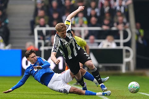 Sunderland's Chris Rigg, left, and Newcastle United's Lewis Hall battle for the ball during the Premier League match between Newcastle and Sunderland outside St James' Park, Newcastle upon Tyne, England.