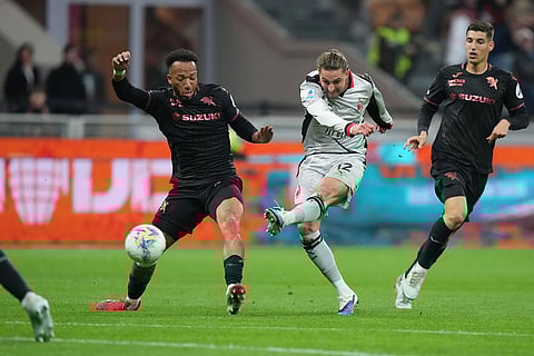AC Milan's Adrien Rabiot, center, attempts a shot on goal during the Serie A soccer match between AC Milan and Torino, in Milan, Italy.