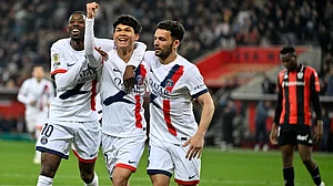 | Photo: AP/Philippe Magoni : PSG's Pedro Fernandez, center, celebrates after scoring his side's third goal during the French League One soccer match between Nice and Paris Saint-Germain in Nice, France, Saturday, March 21, 2026.