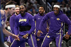 | Photo: AP/Phelan M. Ebenhack : Los Angeles Lakers forward LeBron James, second from front right, and forward Jarred Vanderbilt, right, react after a dunk by guard Austin Reaves, left, during the first half of an NBA basketball game against the Orlando Magic in Orlando, Fla.