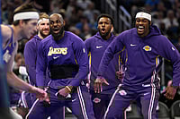 | Photo: AP/Phelan M. Ebenhack : Los Angeles Lakers forward LeBron James, second from front right, and forward Jarred Vanderbilt, right, react after a dunk by guard Austin Reaves, left, during the first half of an NBA basketball game against the Orlando Magic in Orlando, Fla.