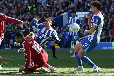 Brighton's Yasin Ayari shoots during the English Premier League soccer match between Brighton and Liverpool in Brighton.