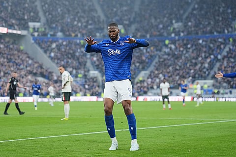 Everton's Beto celebrates after scoring his side's opening goal during the English Premier League soccer match between Everton and Chelsea in Liverpool, England.