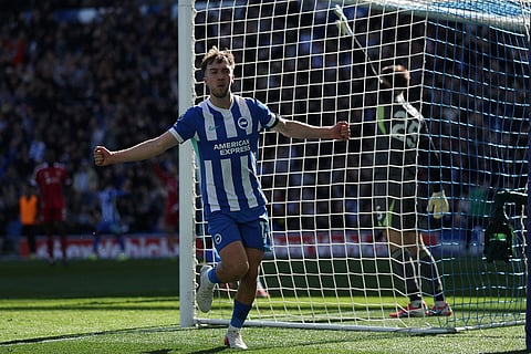 Brighton's Jack Hinshelwood celebrates after a goal during the English Premier League soccer match between Brighton and Liverpool in Brighton.