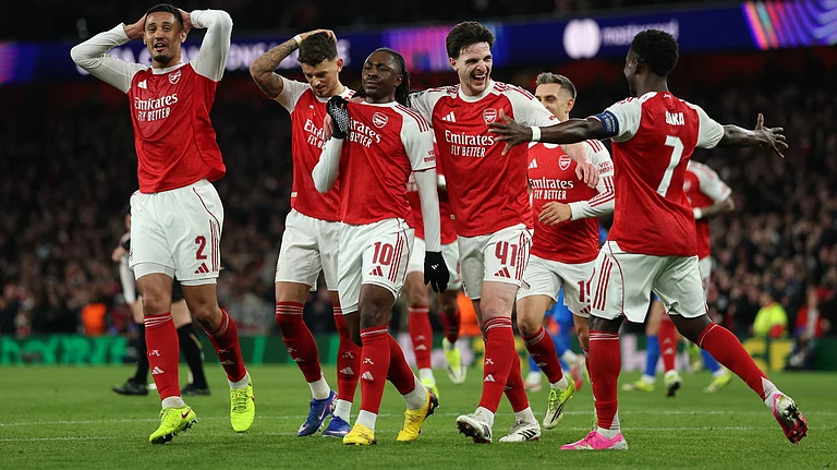 Arsenal's Eberechi Eze center, celebrates with teammates after scoring the opening goal during the second leg of the Champions League round of 16 soccer match between Arsenal and Bayer Leverkusen, in London, Tuesday, March 17, 2026. - | Photo: AP/Ian Walton