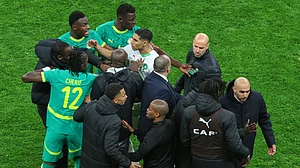 | Photo: AP/Youssef Loulidi : Morocco's Achraf Hakimi, center, clashes with Senegal players after a controversial penalty was awarded to Morocco late on during the Africa Cup of Nations final soccer match between Senegal and Morocco in Rabat, Morocco, Sunday, Jan. 18, 2026.