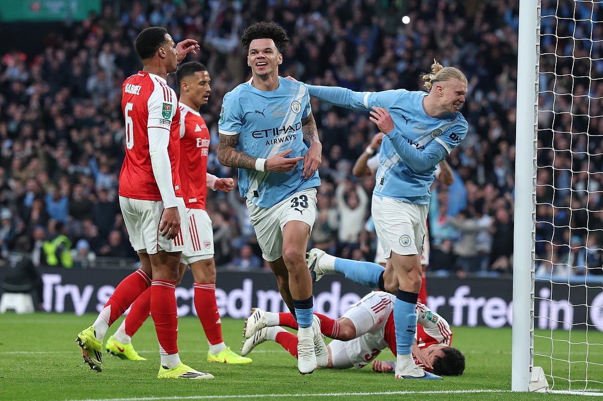 Manchester City's Nico O'Reilly celebrates after scoring the opening goal during the English League Cup final soccer match between Arsenal and Manchester City in London, Sunday, March 22, 2026.