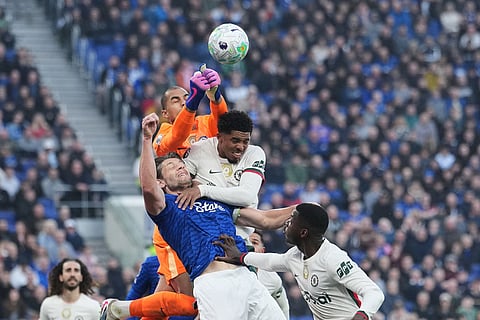 Chelsea's goalkeeper Robert Sanchez punches the ball away during the English Premier League soccer match between Everton and Chelsea in Liverpool, England.