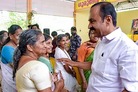 Leader of the Opposition and UDF candidate from Paravur constituency VD Satheesan interacts with residents during an election campaign, in Kochi.