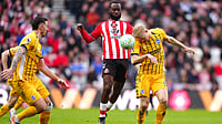 | Photo: AP/Owen Humphreys : Sunderland's Lutsharel Geertruida and Brighton and Hove Albion's Jan Paul van Hecke, right, fight for the ball during the Premier League match in Sunderland, England, Saturday March 14, 2026. 